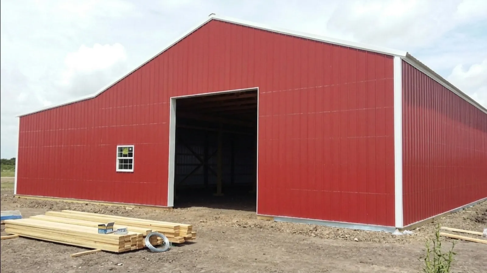 Post-frame hay storage barn